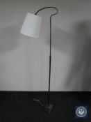 A 20th century brass adjustable standard lamp and shade