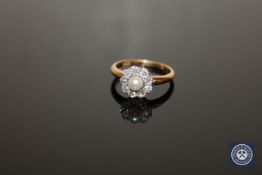 An early 20th century pearl and diamond cluster ring,