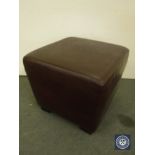 A Burgundy leather footstool