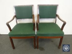 A pair of mid 20th century armchairs in green fabric