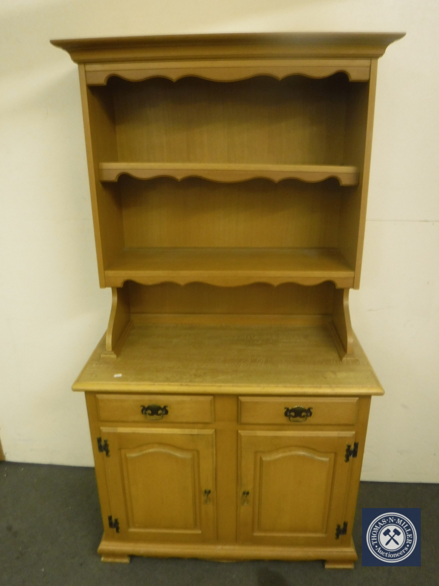 A pine effect kitchen dresser and set of pine open bookshelves