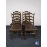 Four oak ladder back dining chairs