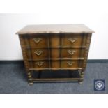A 20th century oak three drawer chest