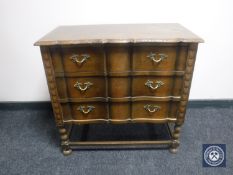 A 20th century oak three drawer chest