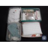 Five storage boxes containing curtains, towels, bedding etc.