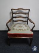 A continental ladder back armchair in floral tapestry