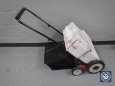 An Eckman multi-function lawn mower / scarifier / rotorvator and accessories