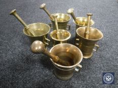 Six brass pestles and mortars (6)