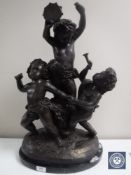 A large reproduction bronze figure of three putti, on marble base,