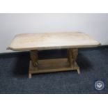 A two tier coffee table on elephant supports