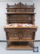 A 19th century continental mahogany marble topped buffet backed sideboard