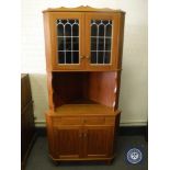 A mid 20th century teak corner display cabinet