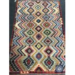 An Afghan wool rug,