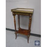 A French mahogany marble topped occasional table with gilt mounts