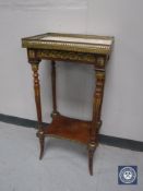 A French mahogany marble topped occasional table with gilt mounts