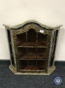 A painted glazed wall mounted display cabinet
