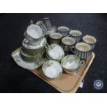 A tray containing Denby coffee cans and saucers,