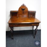 A late 19th century walnut inlaid writing table fitted three drawers