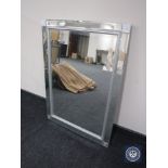 An all glass framed sectional mirror