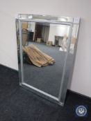An all glass framed sectional mirror