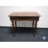 A Victorian mahogany writing table fitted two drawers