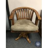 A pine swivel office chair,