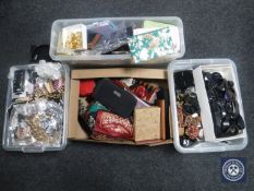 Three plastic crates and box containing hair accessories, belts,