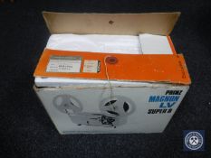 A boxed Prinz Magnon LV super 8 projector with Tom and Jerry Reel