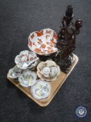 A tray of Oriental wares including carved hardwood figured lamp, rice bowls, egg cups etc.