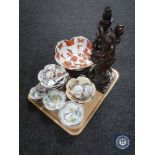 A tray of Oriental wares including carved hardwood figured lamp, rice bowls, egg cups etc.