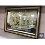 A gilt and silvered framed mirror bearing Fry's Chocolate advertisement