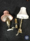 A brass miners lamp converted to a table lamp together with two further brass table lamps