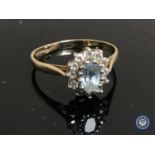 A 9ct gold diamond and aquamarine cluster ring.