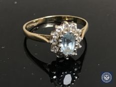 A 9ct gold diamond and aquamarine cluster ring.