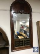 A late 19th century mahogany domed topped mirror
