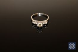 A diamond solitaire ring,