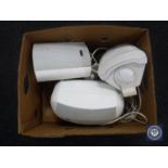 A box of three outdoor speakers