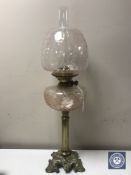 A Victorian brass oil lamp with glass reservoir,