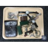 A tray of assorted wristwatches, whistles, coins, leather pouch, costume jewellery etc.