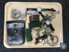 A tray of assorted wristwatches, whistles, coins, leather pouch, costume jewellery etc.