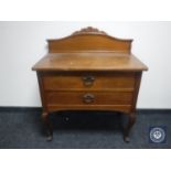 An early 20th century continental oak two-drawer table