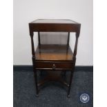An antique mahogany miniature wash stand fitted a drawer