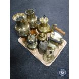 A tray containing two embossed brass vases, brass kettle, iron,