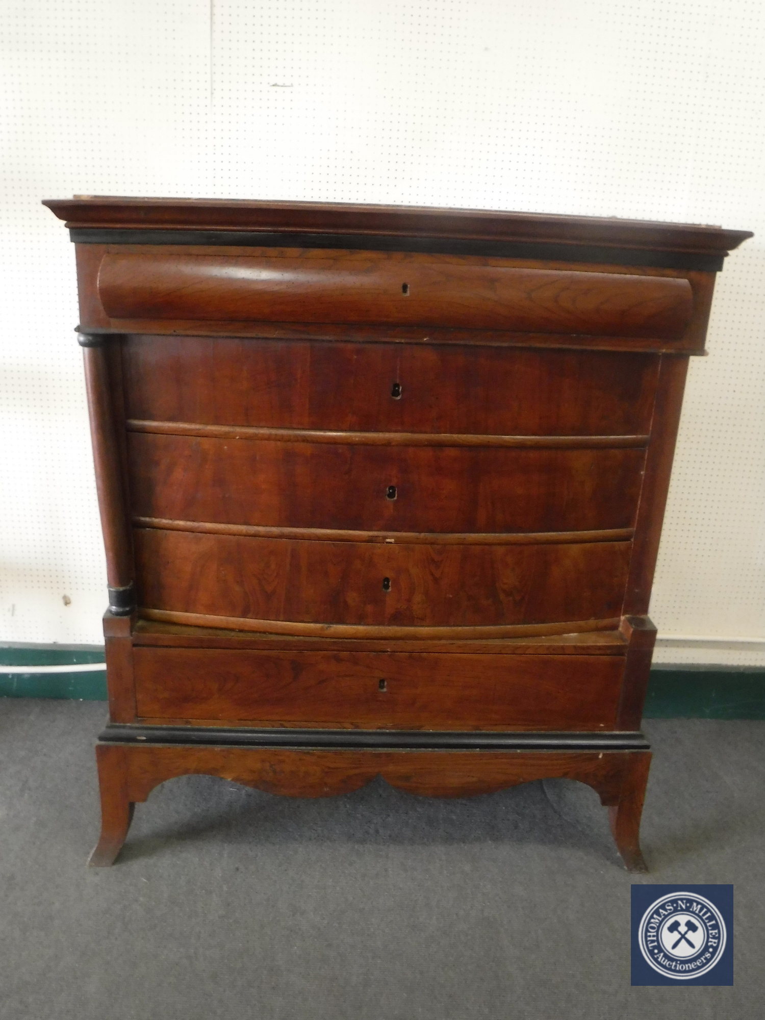 A late 19th century continental mahogany five drawer chest with pillar supports