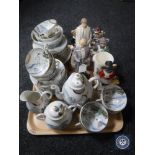 A tray of Japanese egg shell tea service together with six assorted figurines