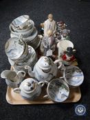 A tray of Japanese egg shell tea service together with six assorted figurines