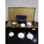 A box of seven assorted pocket watches and fob watches, some with silver cases,