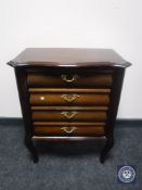 A mid 20th century mahogany four drawer chest