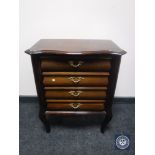 A mid 20th century mahogany four drawer chest