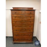 A continental mahogany seven drawer chest,